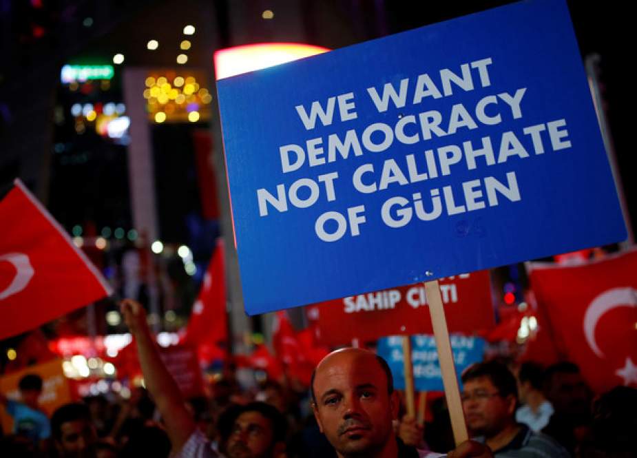 Recep Tayyip Erdogan supporter holds a banner in central Ankara, Turkey.JPG