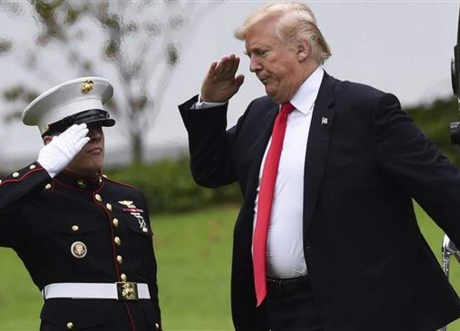 US President Donald Trump salutes to Marine One on the South Lawn of the White House in Washington DC.jpg