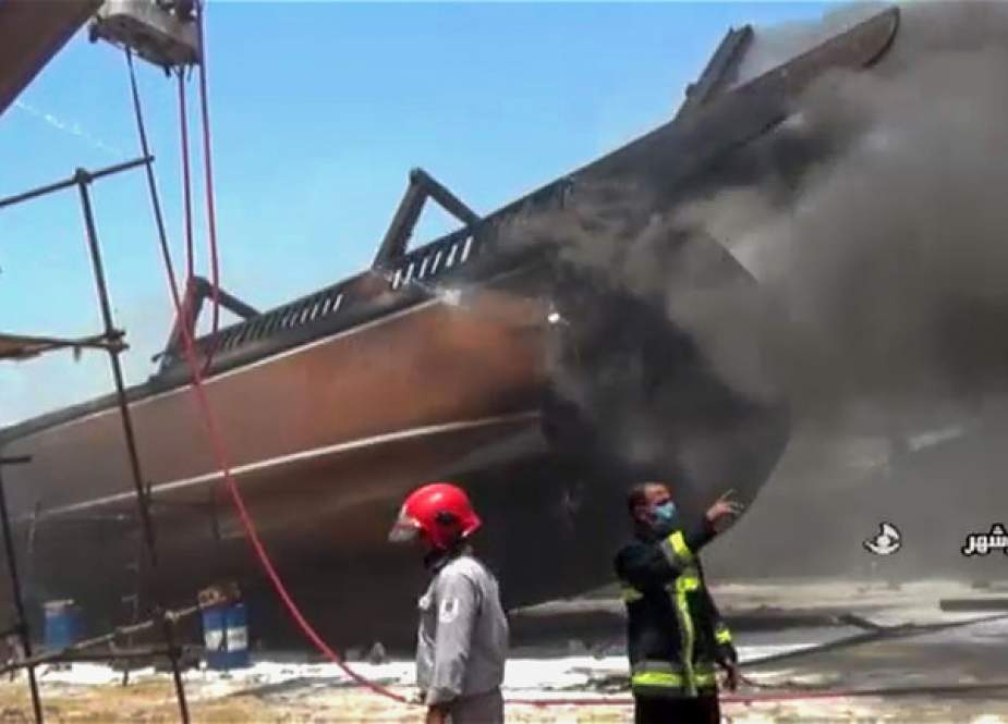 Firefighters combatting a blaze at the Delvar Kashti Bushehr boat factory in the Iranian city of Bushehr.jpg