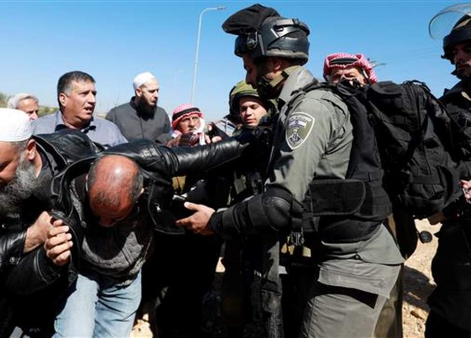 Palestinians, protesting against Israeli machineries bulldozing lands.jpg