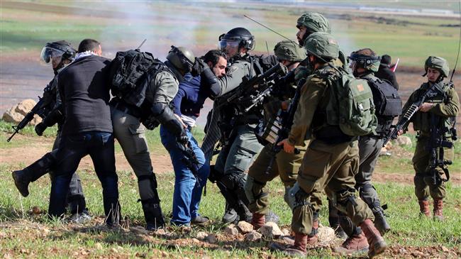 Israeli soldiers arrest a Palestinian outside the West Bank village of Tamun.jpg