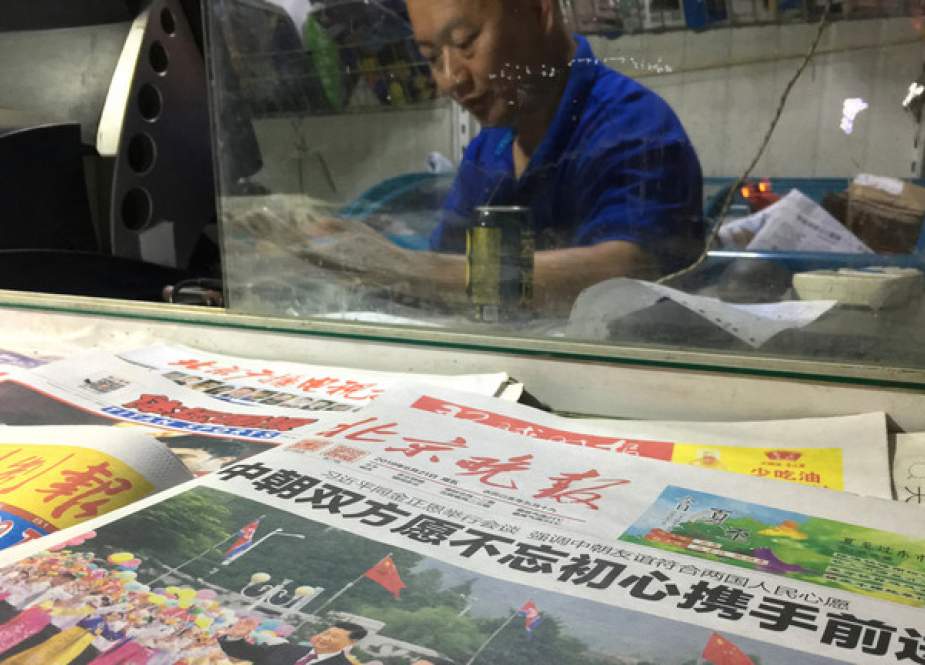 Beijing Evening News newspaper is seen on a news stand in Beijing, China.JPG