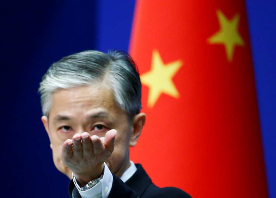 Chinese Foreign Ministry spokesman Wang Wenbin gestures during a news conference in Beijing, China.JPG