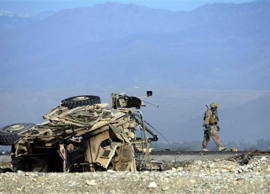 US soldier inspects the site of an attack targeting foreign troops in Jalalabad, Afghanistan.jpg