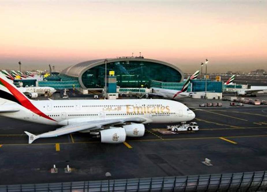 Emirates Airline passenger planes at Dubai International Airport, the United Arab Emirates..jpg