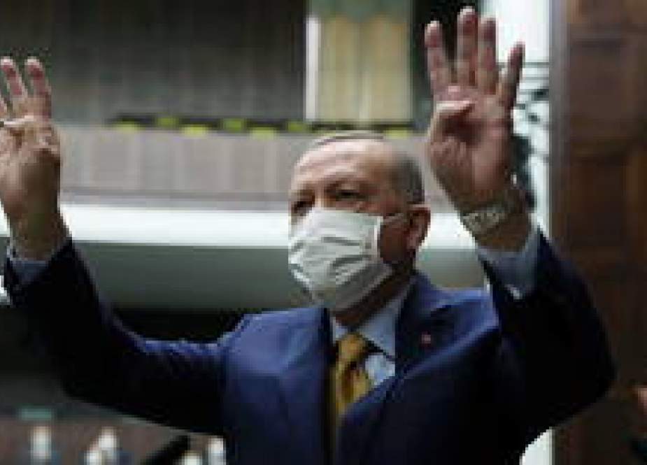 Turkish President Recep Tayyip Erdogan greets members of his ruling AK Party at the parliament in Ankara.JPG