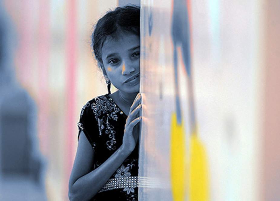 A girl looks on at the malnutrition ward of a hospital in the Yemeni capital, Sana’a.jpg