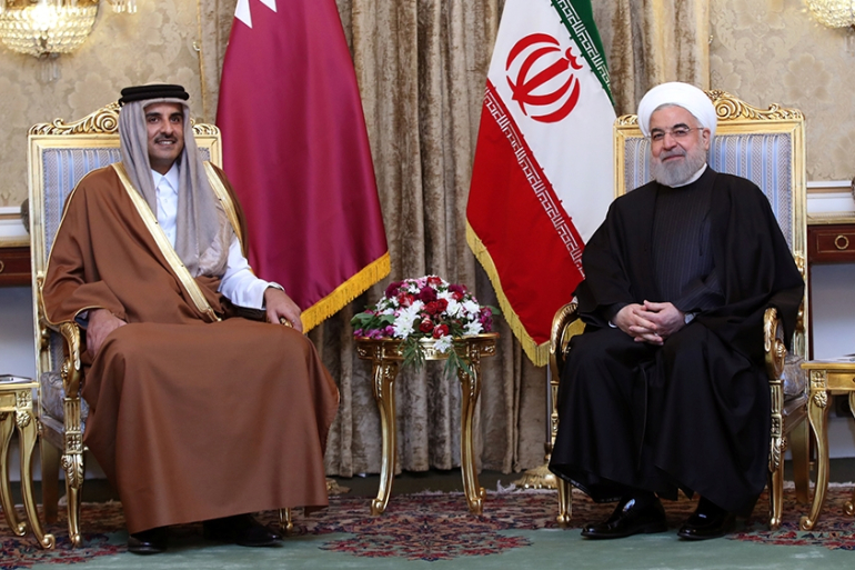 Iranian President Hasan Rouhani and Qatari Emir Tamim bin Hamad Al Thani