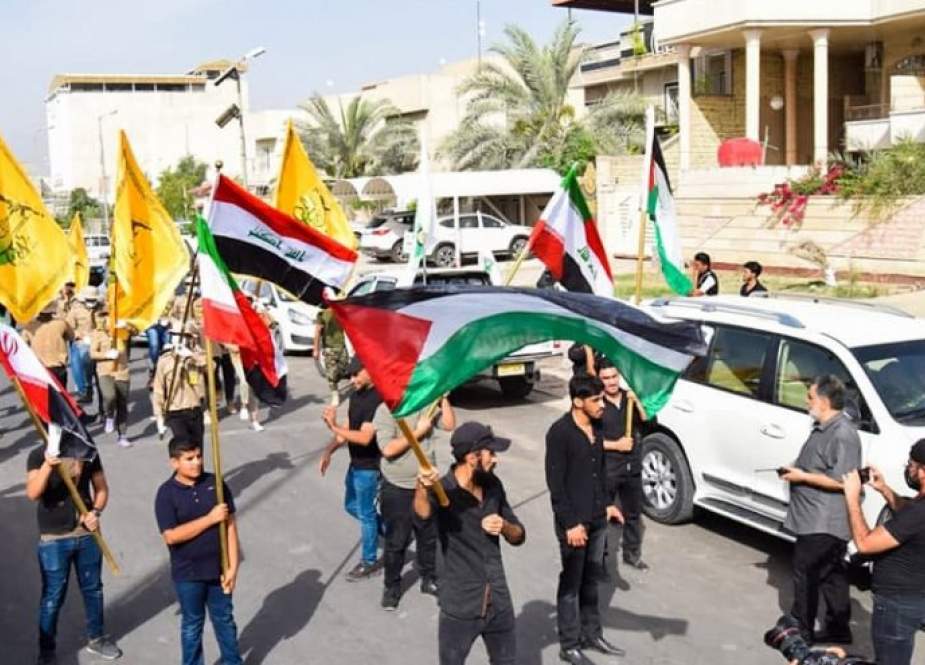 النجباء يرفعون اعلام الدفاع عن فلسطين في كل انحاء العراق