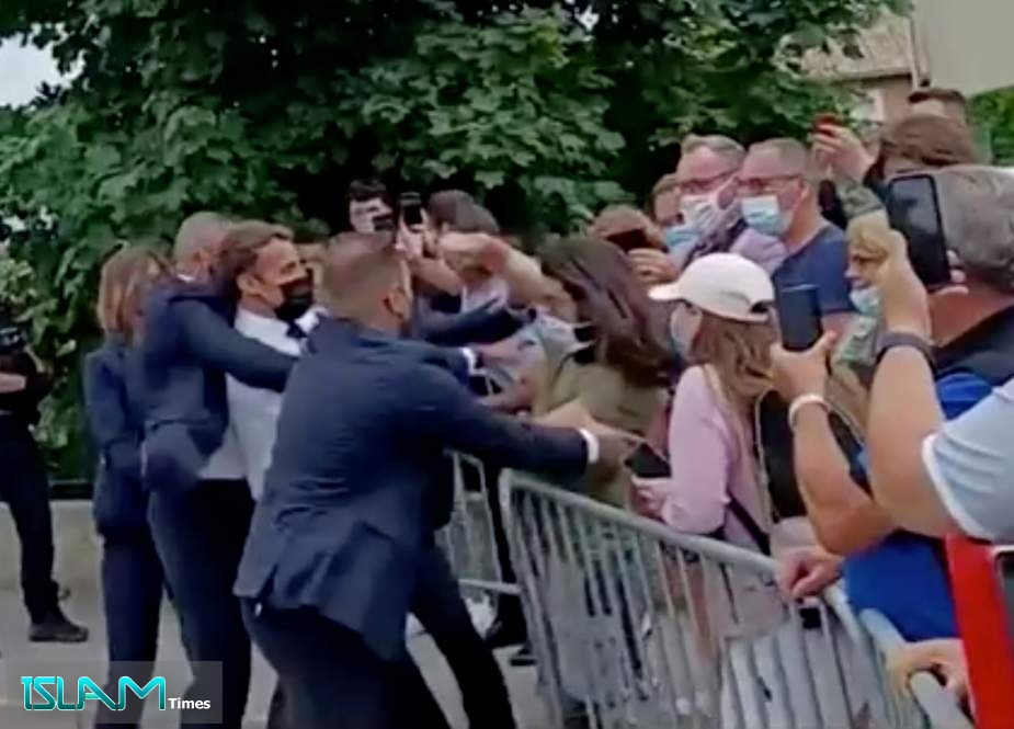 French President Slapped in Face during Walkabout