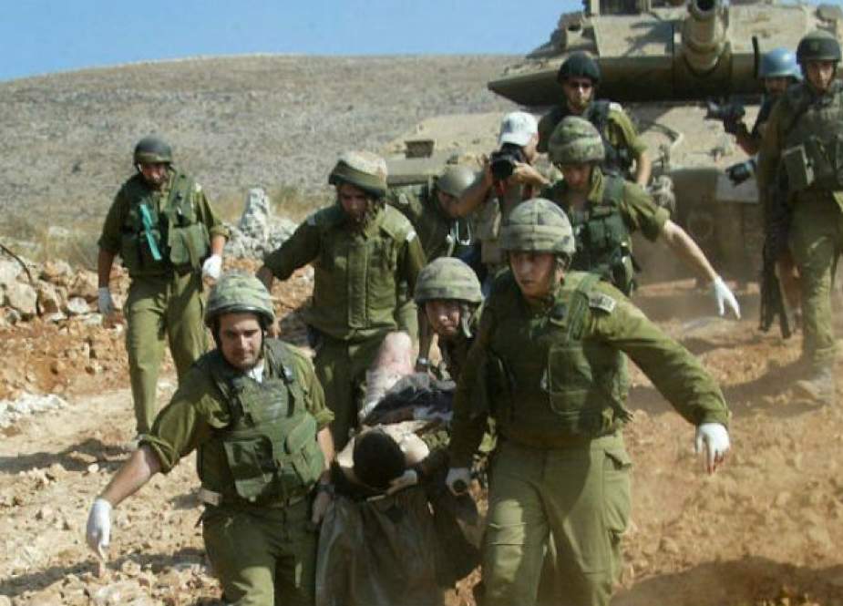Israeli occupation forces evacuating injured soldiers following fierce clashes with Hezbollah fighters in south Lebanon.jpg