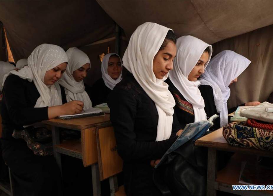 Afghan schoolgirls attend a class at a local school in Herat province.jpg