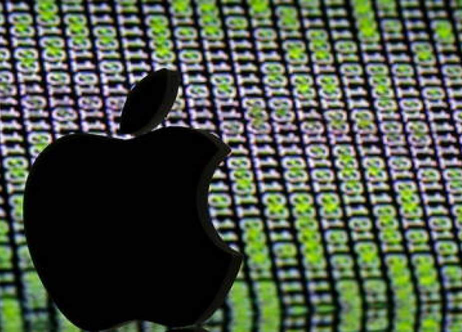 Apple logo, is seen in front of a displayed cyber code in this illustration.jpg