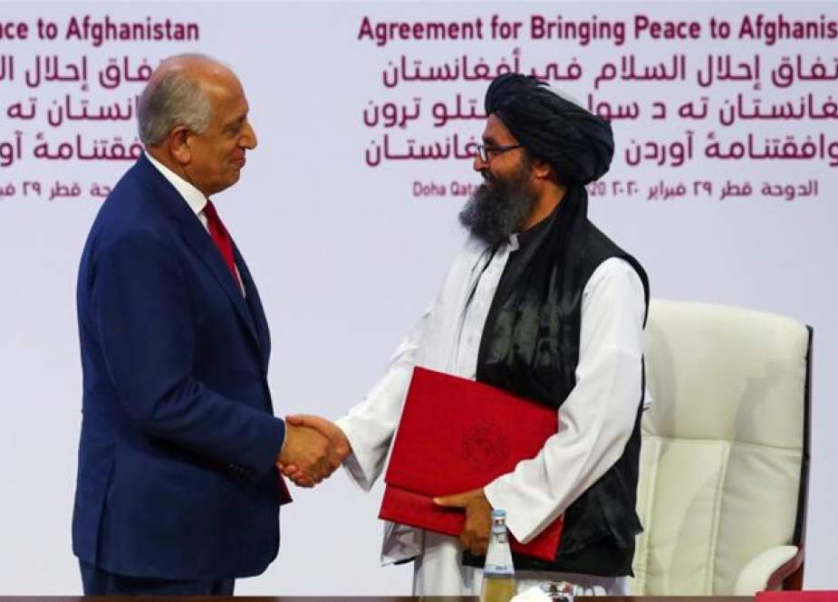 Zalmay Khalilzad, the US envoy for Afghanistan, and Mullah Abdul Ghani Baradar, the chief Taliban negotiator, in Qatar.jpg