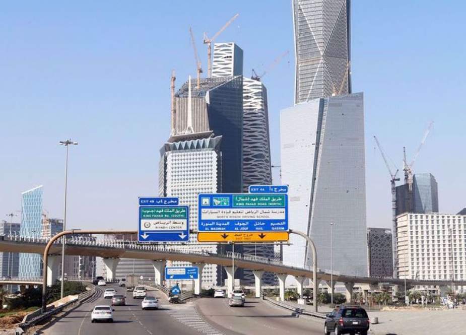 Cars drive past the King Abdullah Financial District in Riyadh, Saudi Arabia.jpg