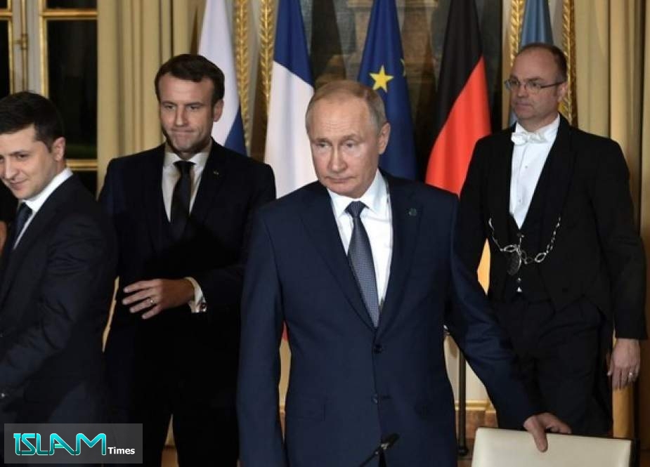 Volodymyr Zelensky, Emmanuel Macron and Vladimir Putin at the Elysee Palace in Paris, December 9, 2019.