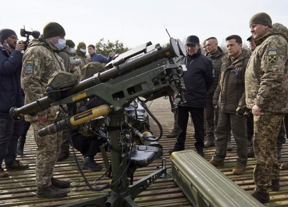 Ukrainian President Volodymyr Zelenskyy inspects anti-aircraft weapons during military drills.