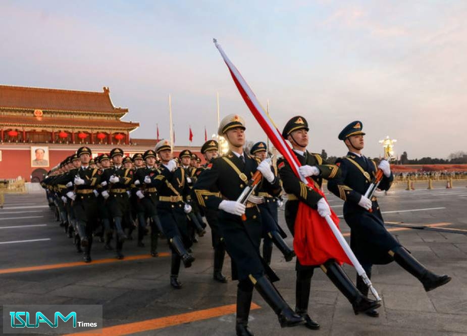 Soldiers raise the Chinese flag in Beijing, China, January 1, 2022.