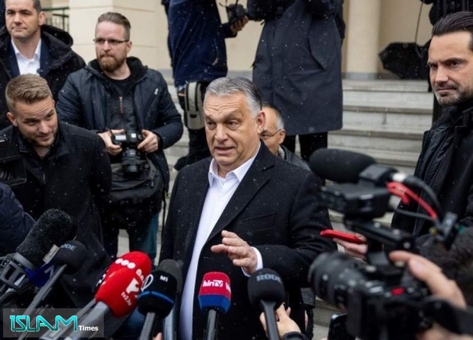 Hungarian PM Viktor Orban speaks to media after casting his ballots during the general parliamentary elections on April 3, 2022, in Budapest.