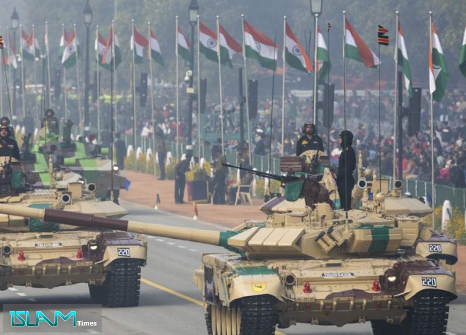 Soldiers on T-90 (Bhisma) tanks march along the Rajpath during the full dress rehearsal for the upcoming Republic Day Parade in New Delhi.