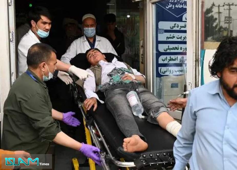Medical staff move an injured person on a stretcher inside a hospital after two bomb blasts at a boys