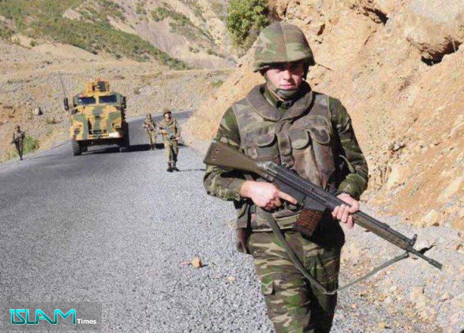 Turkish soldiers patrol a road near Cukurca in the Hakkari province, southeastern Turkey, near the Turkish-Iraqi border.