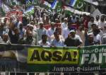 People march in solidarity with Palestinian people in Karachi, Pakistan, on April 22, 2022, after a new round of Israeli violence against Palestinian worshipers broke out at al-Aqsa Mosque in the Old City of al-Quds.