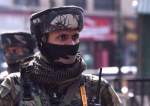 An Indian paramilitary trooper stands guard in Srinagar, Kashmir, on October 12, 2021.