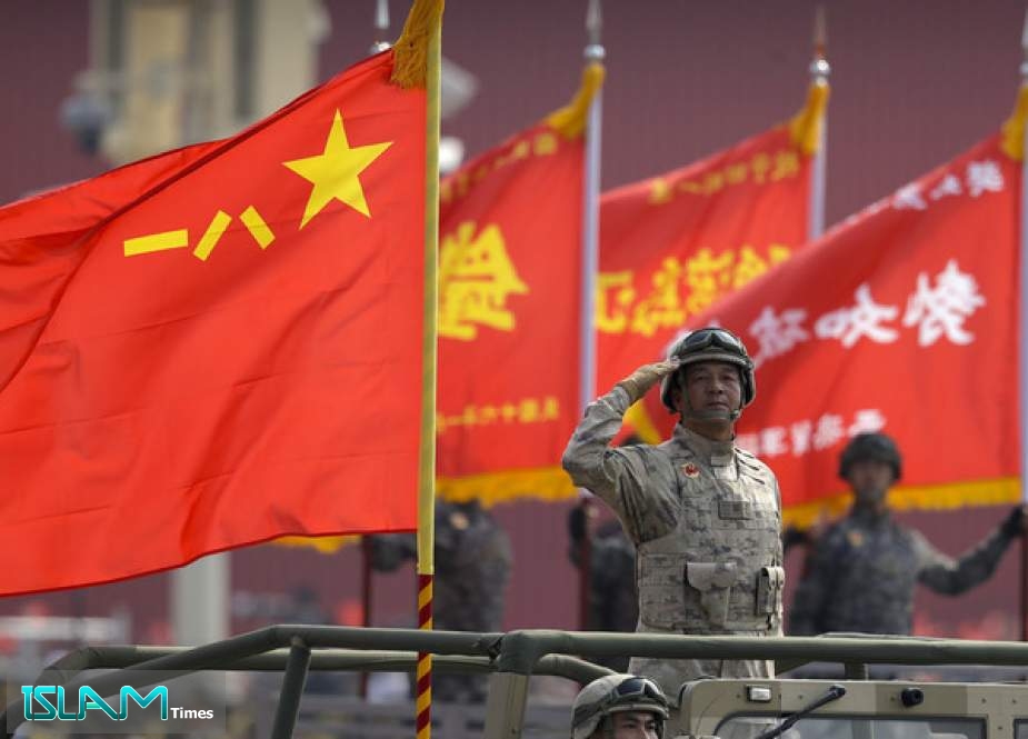 A Chinese military officer salutes during a parade to commemorate the 70th anniversary of the founding of Communist China in Beijing, October 1, 2019.