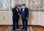 Iranian Deputy Foreign Minister for Economic Diplomacy Mehdi Safari (L) shaking hand with Indonesia’s Deputy Parliament Speaker Rachmad Gobel in Tehran on May 7, 2022.