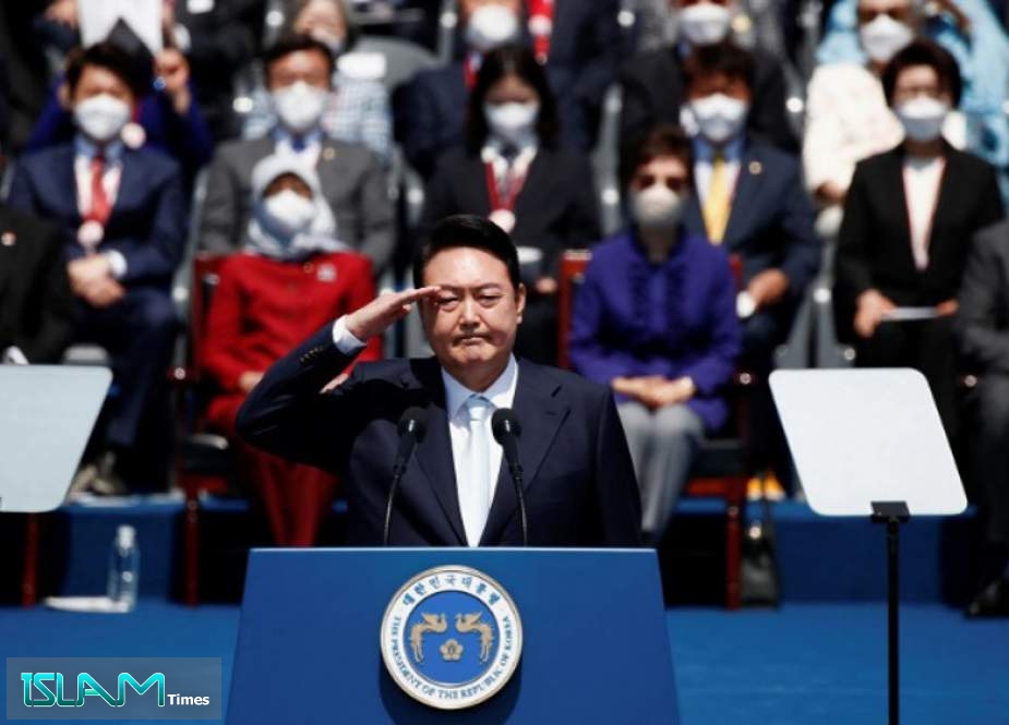 South Korean President Yoon Suk-yeol salutes during his inauguration in front of the National Assembly in Seoul, South Korea, May 10, 2022.