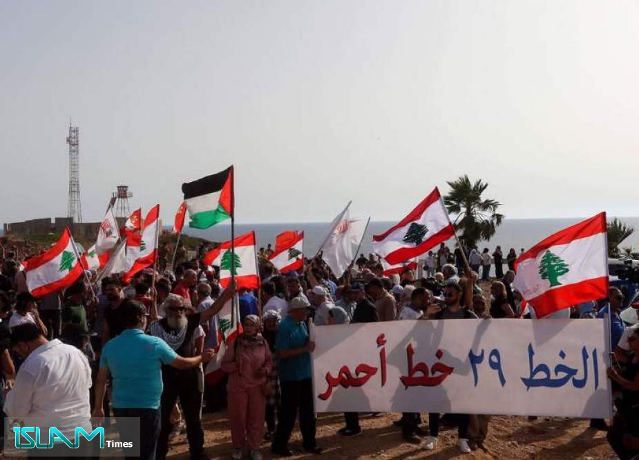 Lebanese protesters take part in a demonstration at the Lebanese southernmost border area of Naqoura, on June 11, 2022, days after Israel moved a gas production vessel into an offshore field.