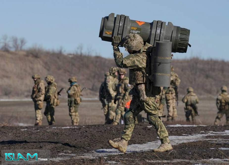A Ukrainian serviceman carries an NLAW anti-tank weapon during an exercise in the Joint Forces Operation, in the Donetsk region, eastern Ukraine.