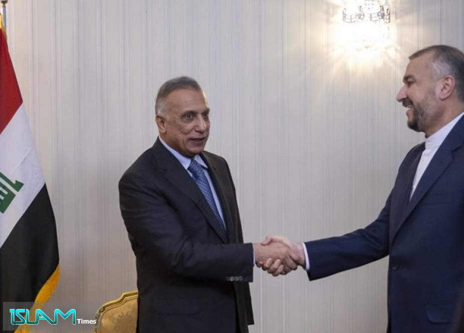 Iran’s Foreign Minister Hossein Amir-Abdollahian (R) meets Iraq’s Prime Minister Mustafa al-Kadhimi in Tehran on June 26, 2022.