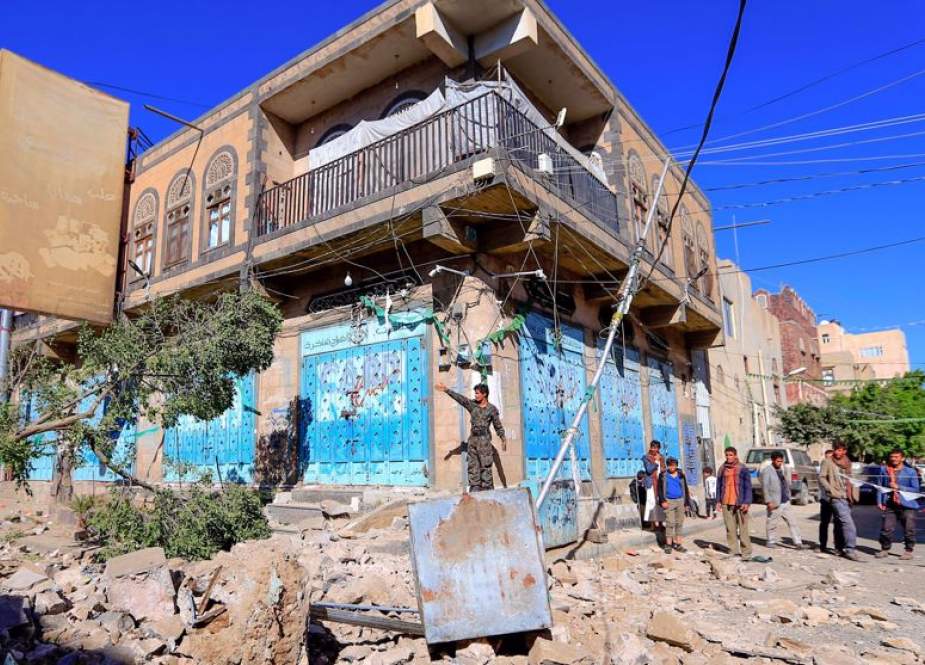 Yemenis inspect damage following an overnight Saudi on the capital Sanaa