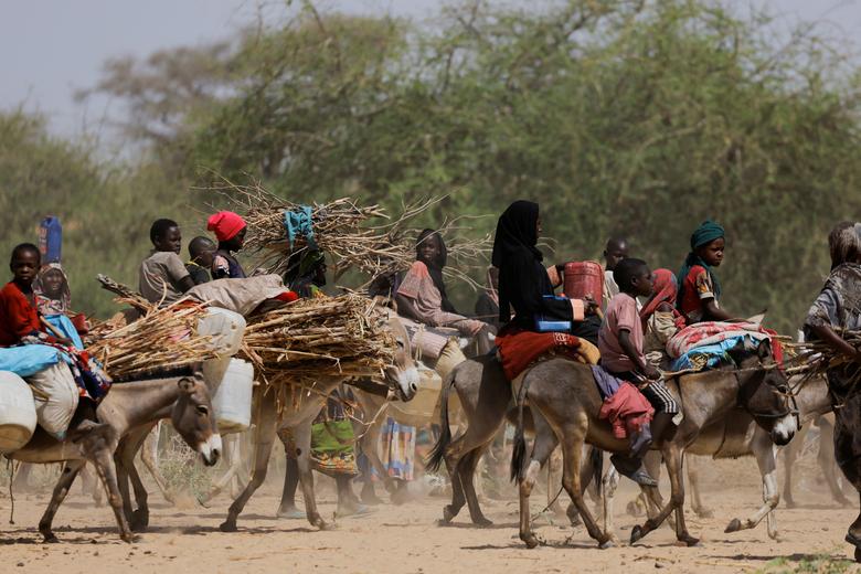 Sudanese refugees, who fled the violence in Sudan's Darfur region and newly arrived ride their donkeys, looking for space to temporarily settle near the border between Sudan and Chad in Goungour, Chad, May 8.