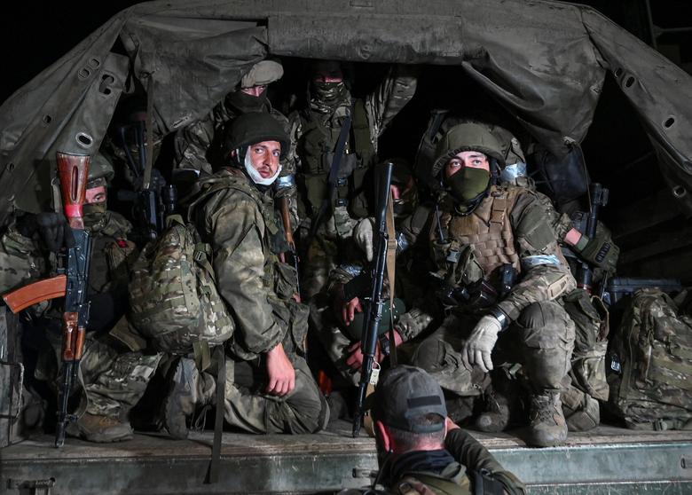 Fighters of Wagner private mercenary group pull out of the headquarters of the Southern Military District to return to base, in the city of Rostov-on-Don, Russia, June 24.