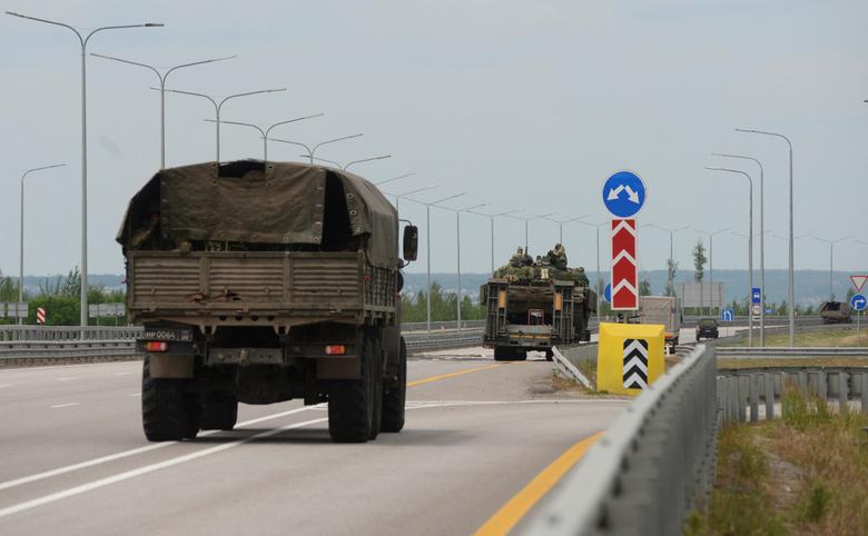 A military column of Wagner private mercenary group drives along M-4 highway, which links the capital Moscow with Russia's southern cities, near Voronezh, Russia, June 24.