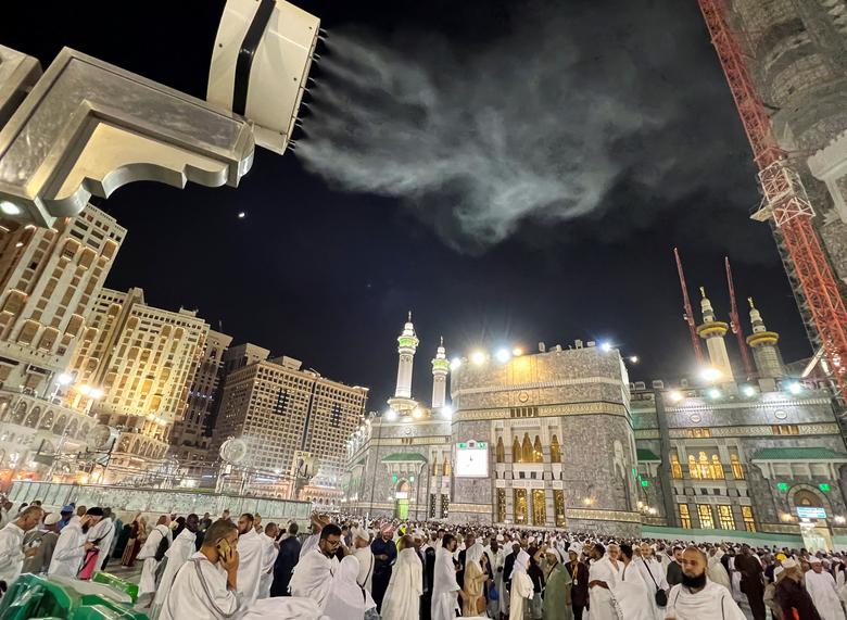 Muslim pilgrims are seen after performing Al-Esha prayer at the holy Kaaba, as they start arriving to perform the annual Haj in the Grand Mosque, in the holy city of Mecca, Saudi Arabia, June 24.