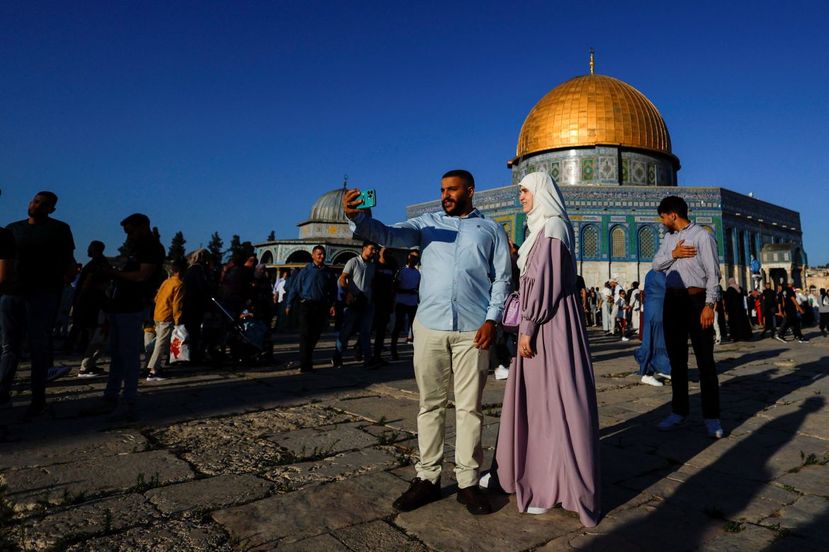 Palestinians celebrate the first day of the Muslim holiday of Eid al-Adha in the Al-Aqsa Mosque compound, in Jerusalem's Old City.