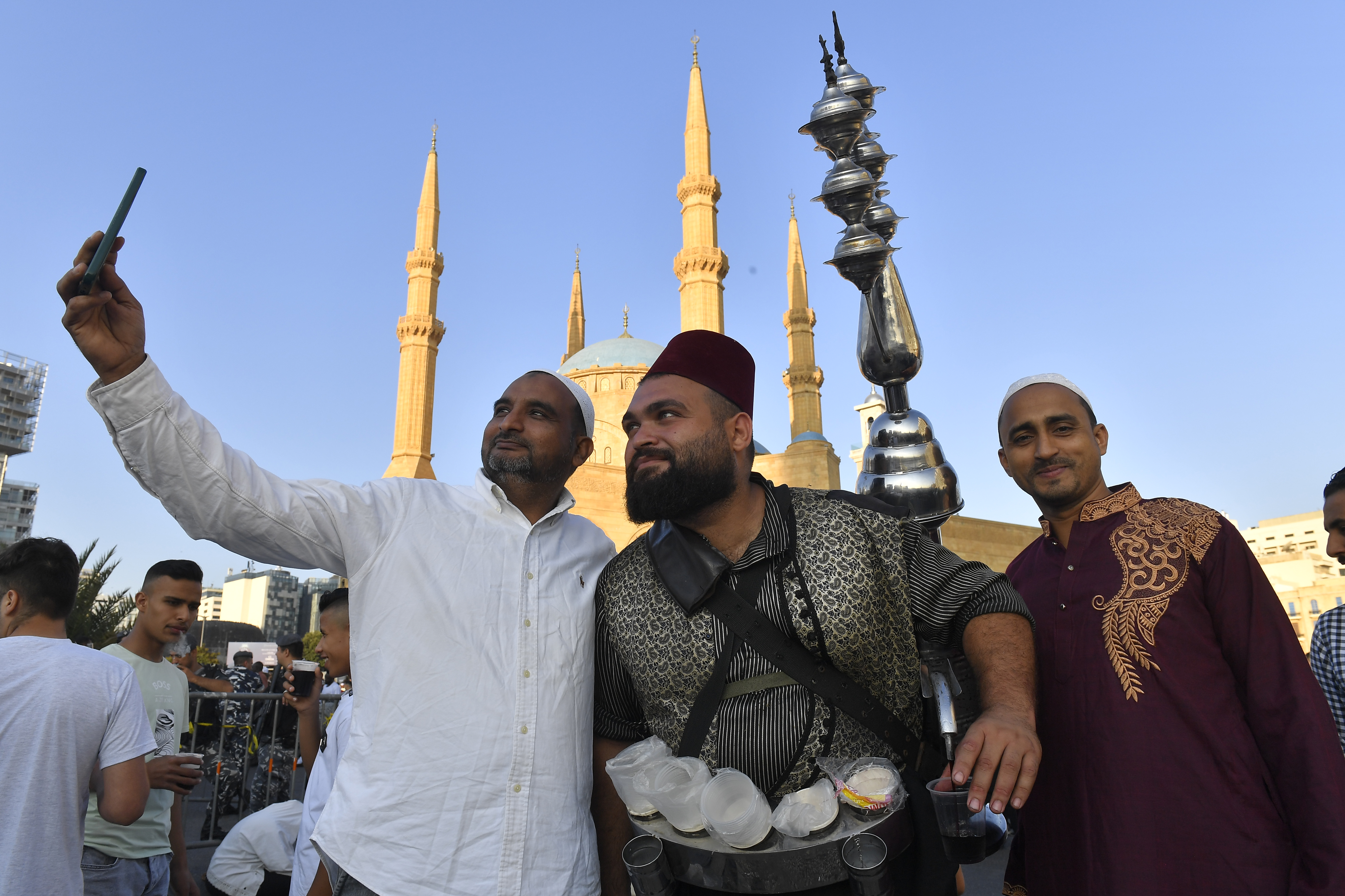 Muslims arrive at the Mohammad Al-Amin Mosque to perform Eid al-Adha prayers in Beirut, Lebanon.