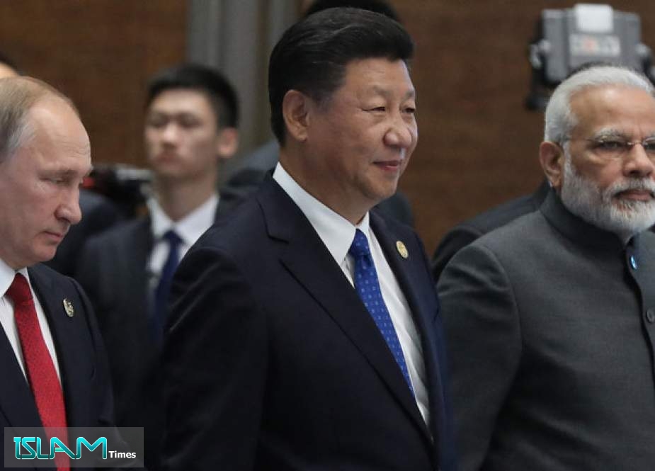 (L to R) Russian President Vladimir Putin, Chinese President Xi Jinping and Indian Prime Minister Narendra Modi.