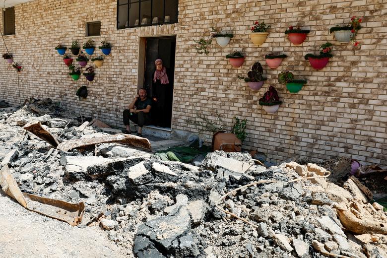 Palestinians view the damage following an Israeli military operation, in Jenin in the Israeli-occupied West Bank July 5.
