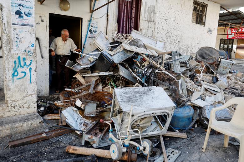 A Palestinian man surveys the damage following an Israeli military operation, in Jenin in the Israeli-occupied West Bank July 5.