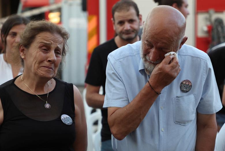 Family members of a firefighter who was killed during the August 2020 Beirut port blast at a memorial ceremony at the fire station in Beirut, August 2.