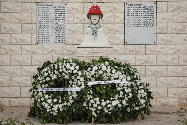 A wreath of flowers at the fire station in Beirut placed near the names of the firefighters who were killed during the August 2020 Beirut port blast, August 2.
