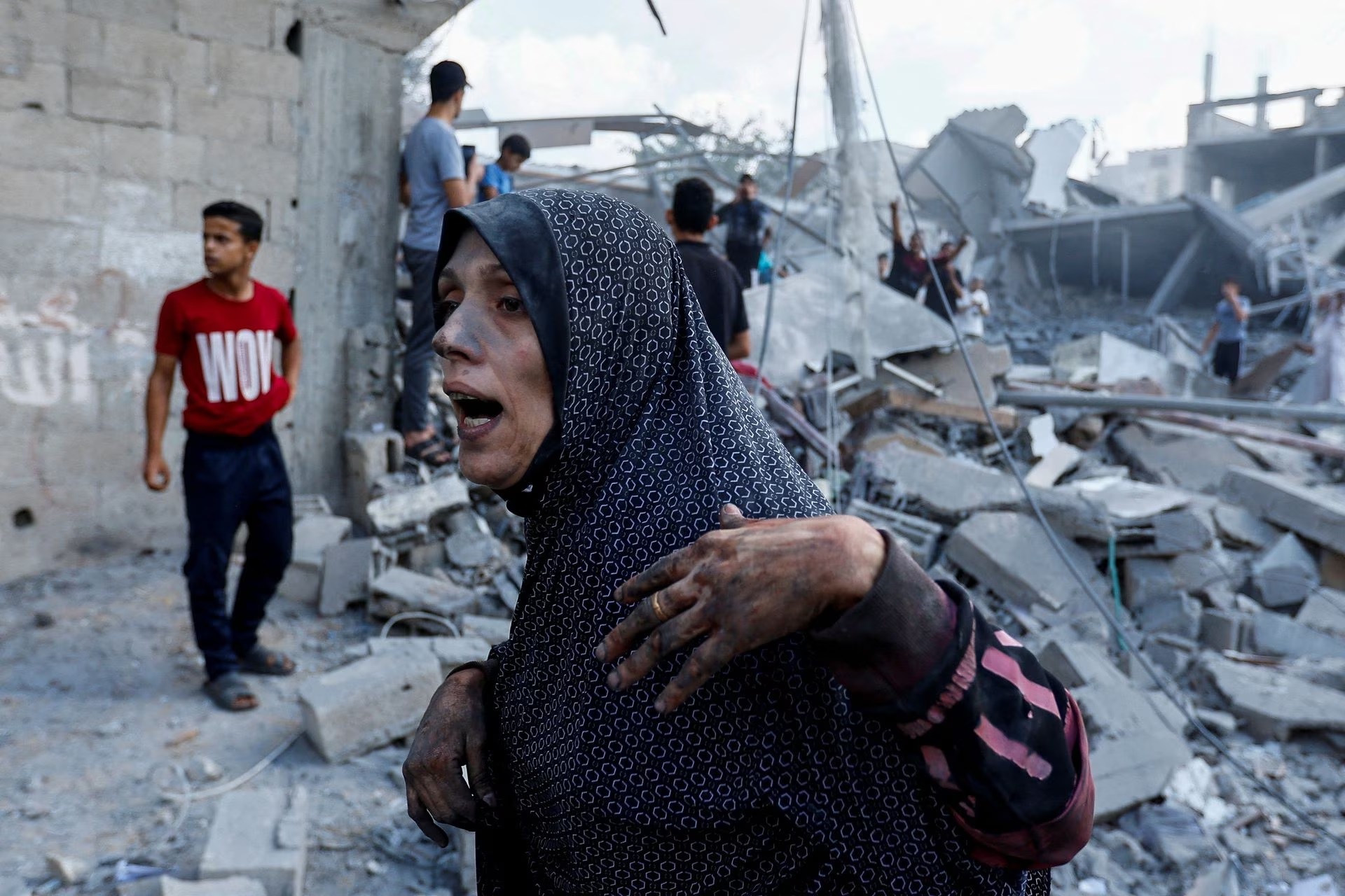 A Palestinian woman reacts at the site of Israeli strikes on houses, in Rafah in the southern Gaza Strip, October 17.