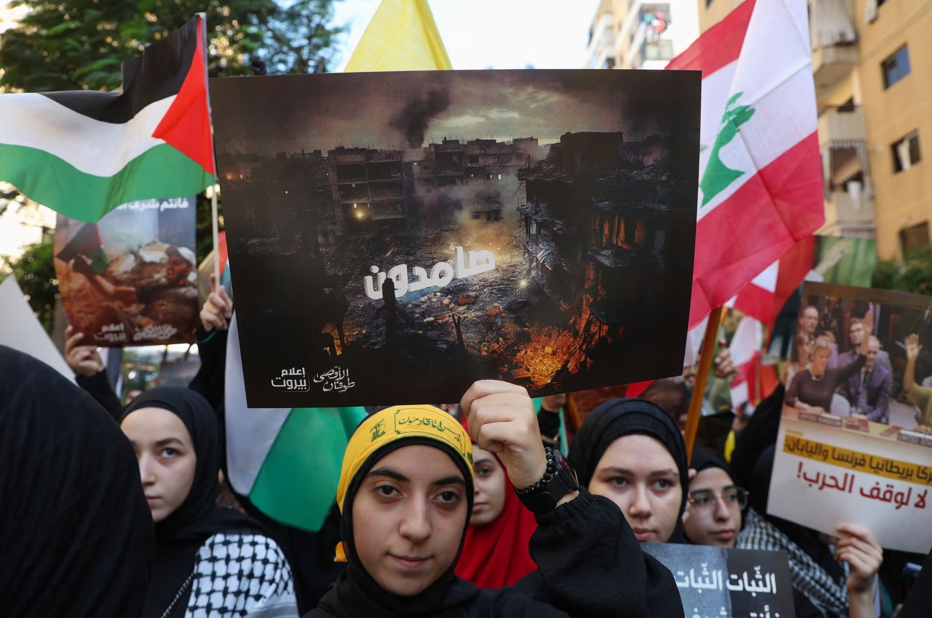 Hezbollah supporters in Beirut's southern suburbs, take part in a protest, after hundreds of Palestinians were killed in an Israeli blast at Al-Ahli hospital in Gaza.