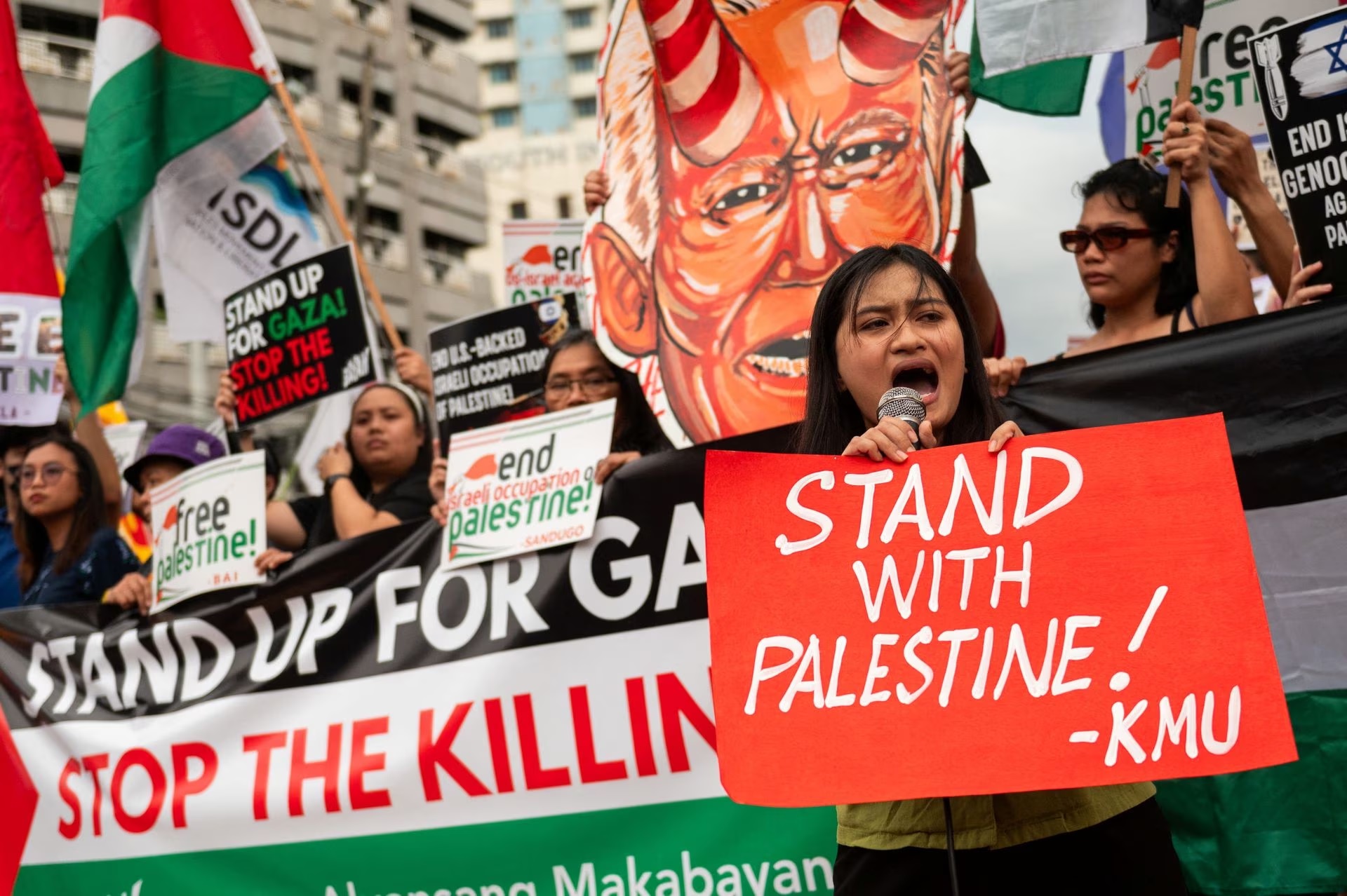 Filipino protesters in Quezon City, Philippines hold a demonstration condemning Israeli blast at Al-Ahli hospital in Gaza.