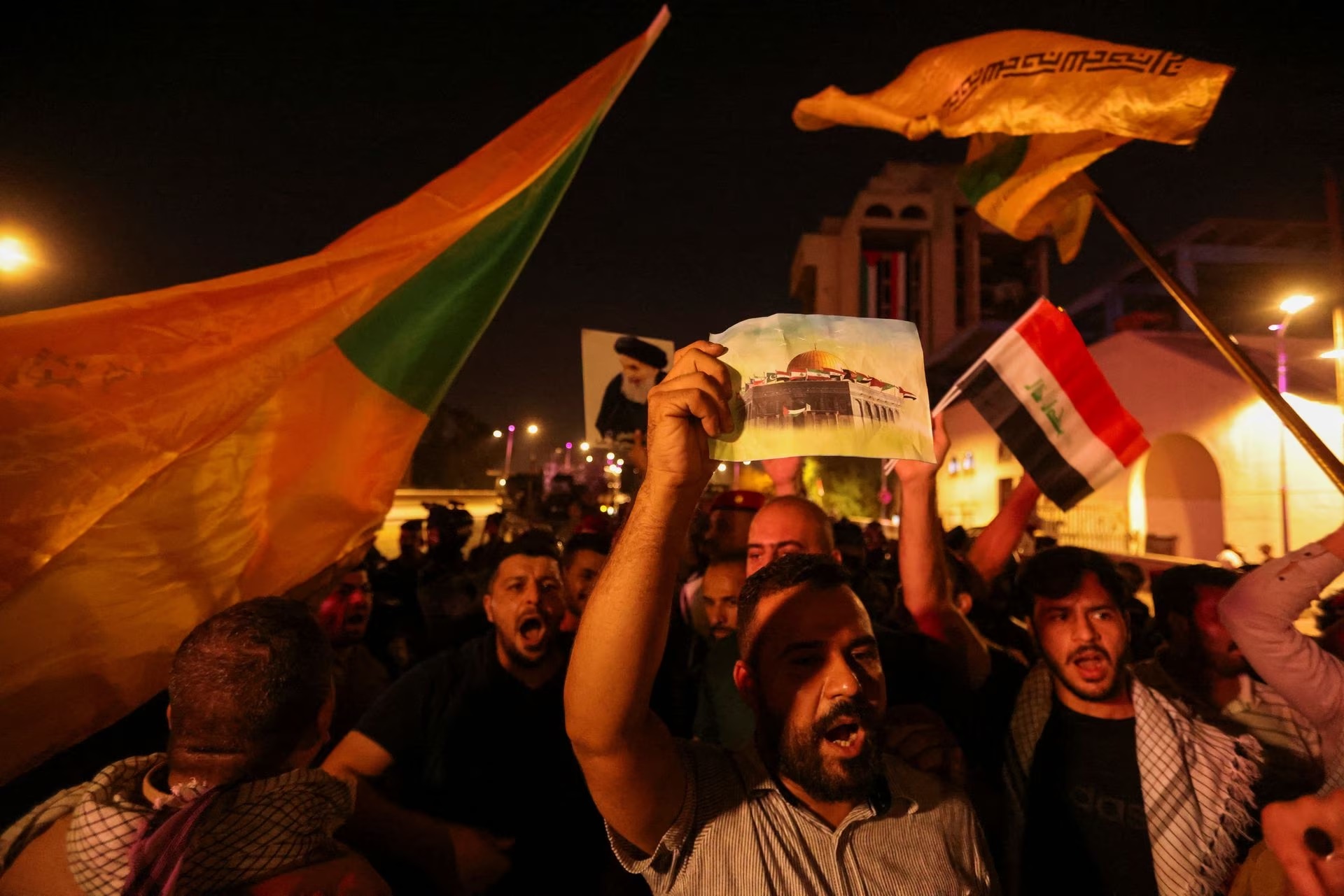 Iraqis take part in a protest after hundreds of Palestinians were killed in an Israeli blast at Al-Ahli hospital in Gaza.